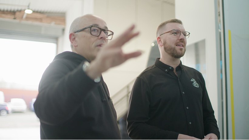 Small business managing director with their Three Business customer success manager discussing the right 5G mobile phone plan for their business