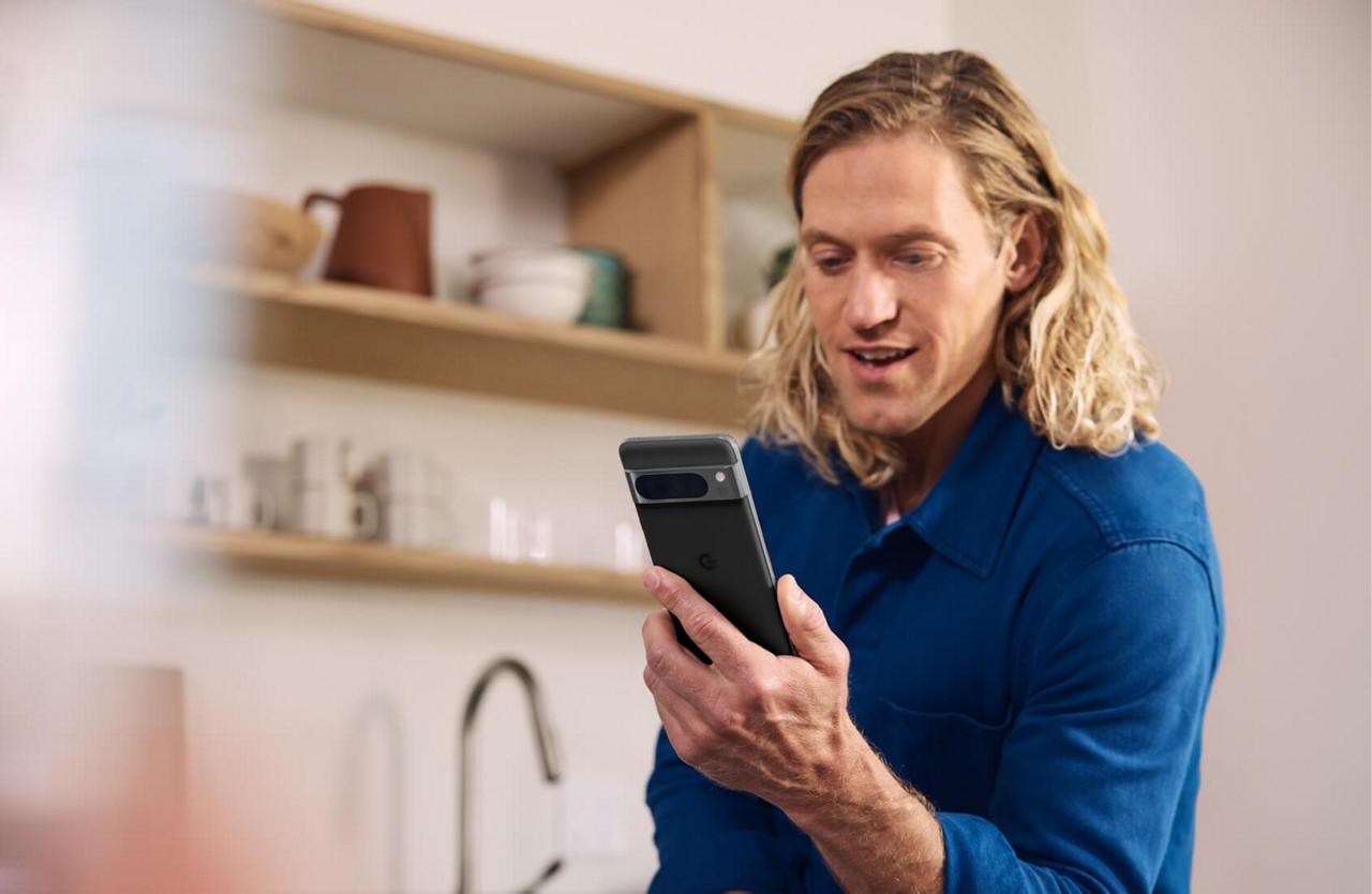 Two girls playing with a tin can telephone in a garden